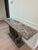 Elegant console table with a thick natural Amazonite quartzite top showing distinctive blue-green veining. Stainless steel...