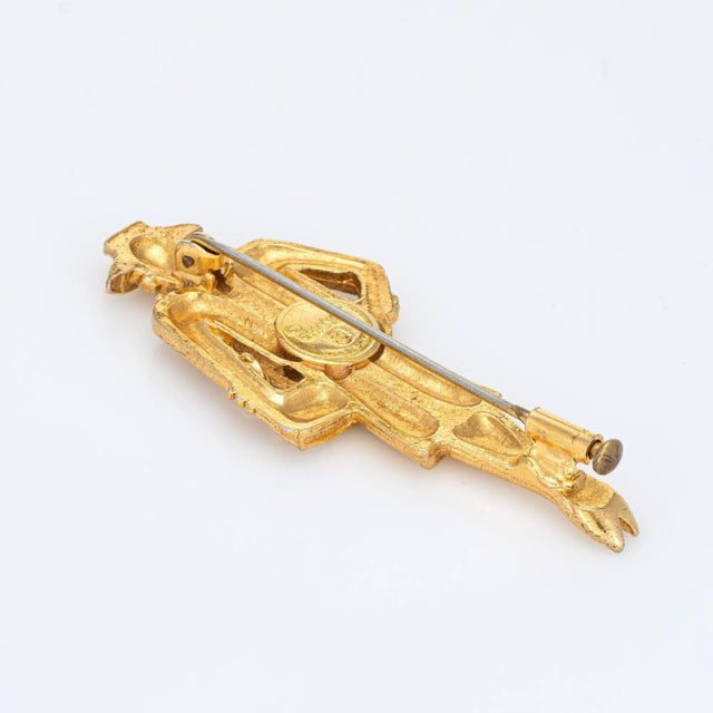 Vintage Chanel brooch (circa 1980s) crafted in yellow gold tone. The brooch highlights the enduring elegance of the...