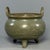 This antique Chinese tripod censer features twin upright handles and beautiful crackle celadon glaze. A fine collectible...