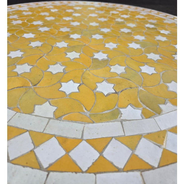 Beautiful handcrafted Moroccan mosaic table featuring an elegant yellow and white color palette. Measuring 32 inches in...