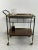 Mid-Century bar trolley in brass, removable trays, 1960s. Intact and in good condition, small signs of the time. It has 4...