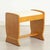 A beautifully proportioned British Art Deco dressing stool, dating to circa 1930 and crafted in richly figured golden...