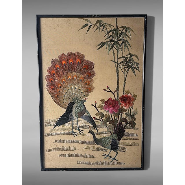 Refined Chinese decorative panel featuring a polychrome embroidery on natural silk, executed between 1920 and 1930 in...