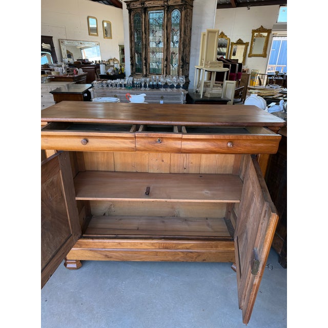 19th Century French Louis Philippe Solid Walnut sideboard made of solid walnut the wood has been finished with a lustrous...
