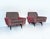 A unique pair of 1950s mid-century armchairs, entirely reupholstered in burgundy velvet with geometric shapes that create...