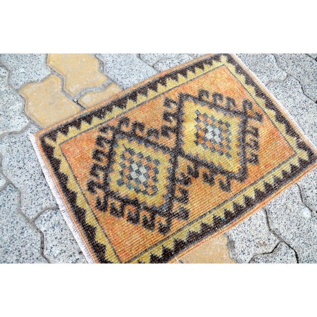 This is a vintage Turkish Oushak rug from the 1960s. The piece was hand-knotted.