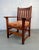 Classic vintage mission oak chair. The design is complemented by an upholstered seat cushion, balancing durability with...