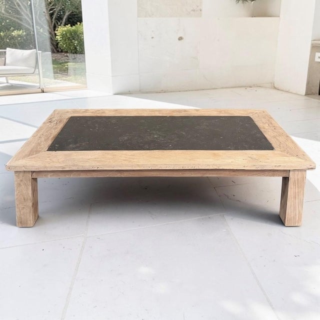 A striking example of mid-century Belgian design, this substantial coffee table combines the warmth of solid oak with the...