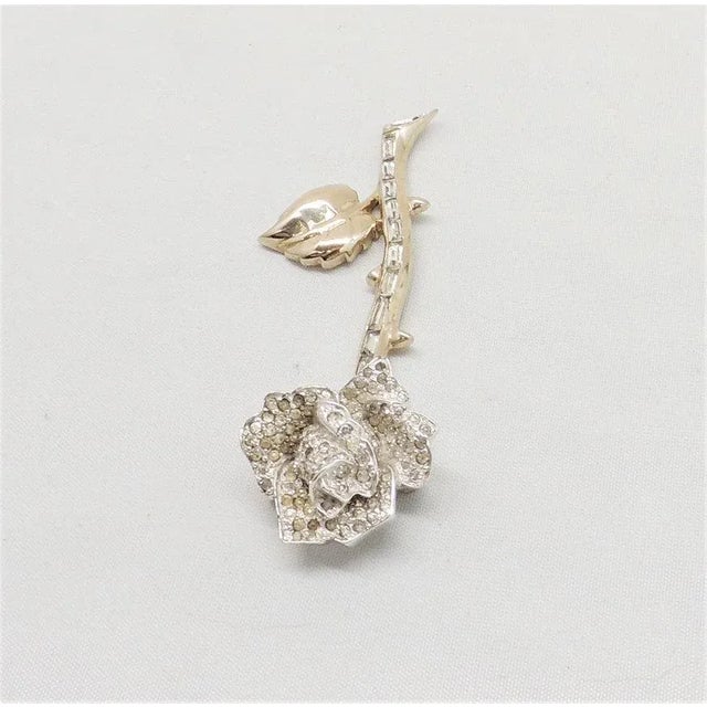 This is part of Chairish’s Costume Jewelry assortment. Very rare 1950s rhodium plated rose with pave clear round...