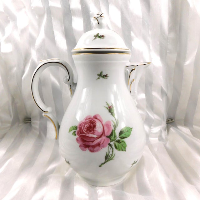 This is a white chocolate pot or teapot with a matching lid. It is marked as shown, but I cannot find whose mark that is....