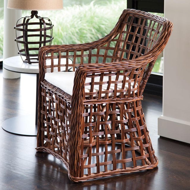 The open weave of this rattan armchair is a shining example of centuries old craftsmanship. Made by some of the world, s...