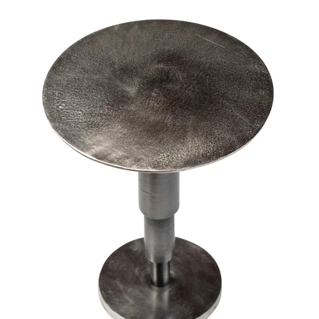 Modern deco cast aluminum round side table with antiqued blackened nickel finish. Each table has variations in finish and...