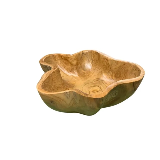 This teak live edge bowl is a unique piece showcasing the natural beauty of teak wood. Crafted by skilled artisans, its...