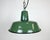 Industrial green enamel pendant light made in Poland during the 1960s. White enamel inside the shade. Iron top. The...