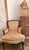Antique Louis XV style Bergère with a shaped upholstered back, outscrolled arms, and a loose seat cushion, raised on...