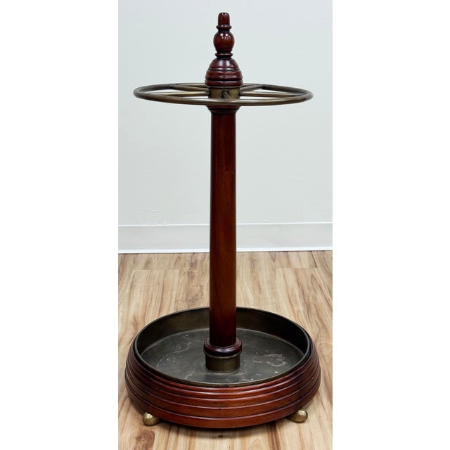 Vintage English Edwardian period style turned wood and brass umbrella stand. Reflects characteristics of the Edwardian era...