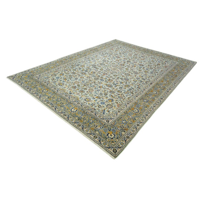 A particularly elegant Kashan oriental rug, hand-knotted and with an unusual coloring in a pistachio green base tone. The...