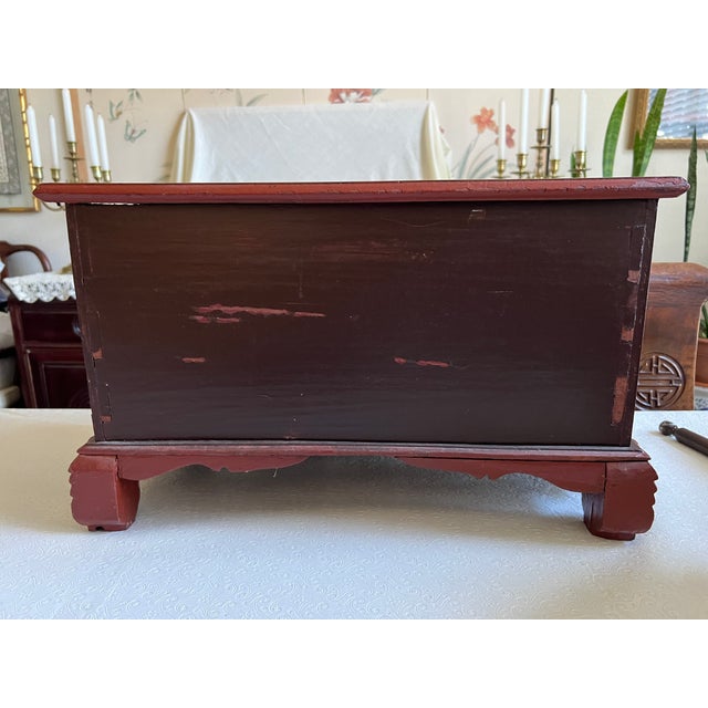 An elegant late 19th century Chinese gilded jewelry box with a variety of six drawers each fronted with carved narrow...