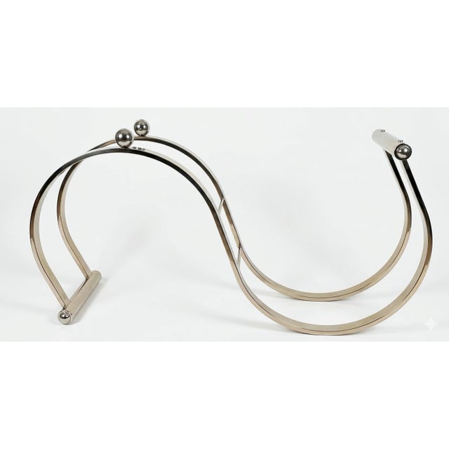 Post modern S curved glass and mixed metals console or sofa table. Fun design. I believe the base is a polished nickel...