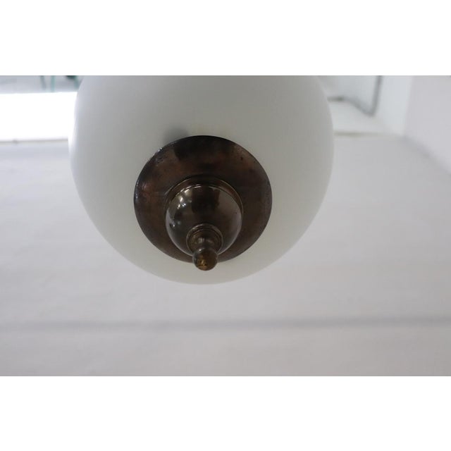 Introducing a stunning pendant lamp from Italian production, circa 1960s. This exquisite piece features a beautifully...