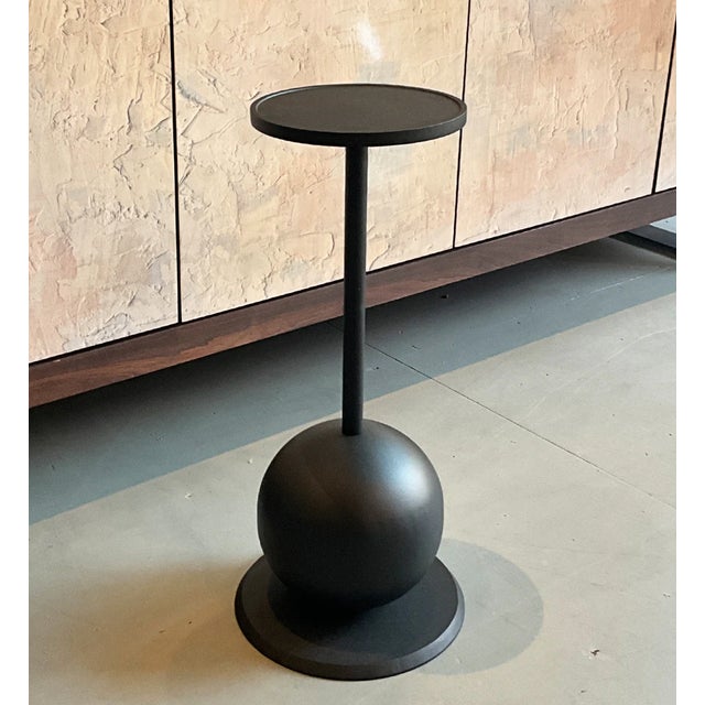 The Jasper Drinks Table is a striking study in balance, proportion, and sculptural simplicity. Constructed entirely of...