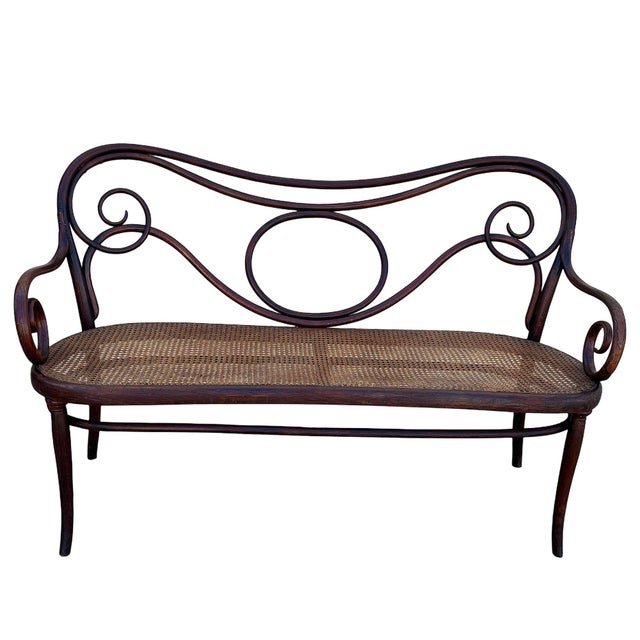 Late Victorian No. 08 Bent oak settee by Jacob & Josef Kohn featuring an elegant, sculptural frame crafted from warm-toned...