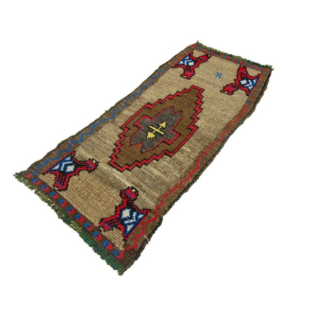 Vintage Handknotted decorative mini rug from Kars region of Turkey. Approximately 45-55 years old. In very good condition.