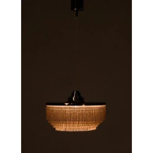 Hans-agne jakobsson t603 pendant with fringes. Produced in sweden by hans-agne jakobsson ab in markaryd, 1970s. This piece...