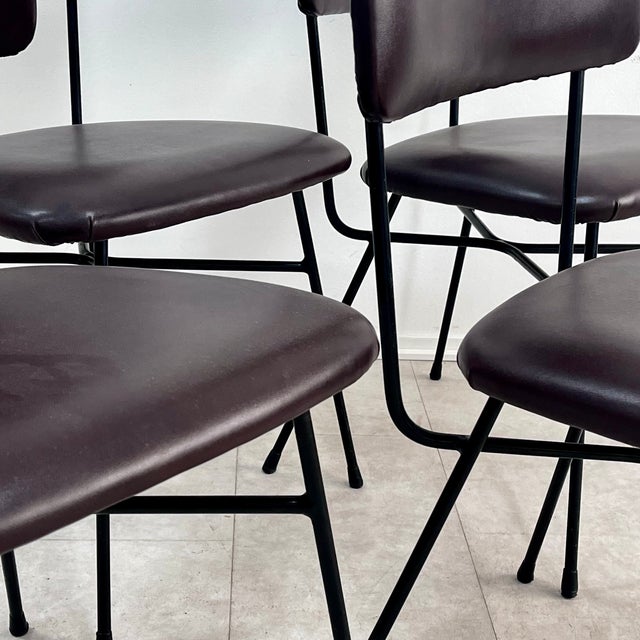 An elegant set of four dining chairs made in Italy during the 1950s. This set perfectly embodies the Midcentury Modern...