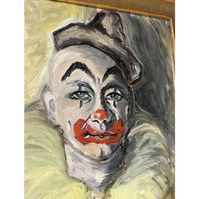 An expressive oil painting on canvas depicting the face of a clown with melancholy features, characterized by bold...
