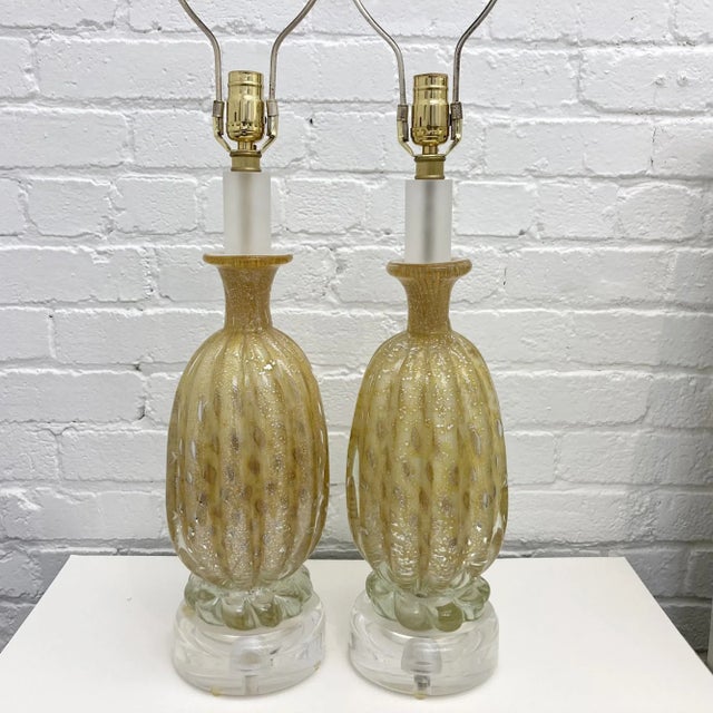 These pair Of Vintage Mid Century Italian Murano Glass, Table Lamps in Gold and Butter Color with Silver Flakes Designed...