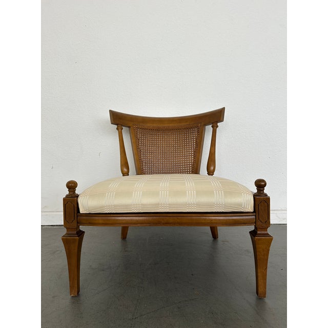 This striking pair of vintage slipper chairs features a unique fusion of Neoclassical and Hollywood Regency influences,...