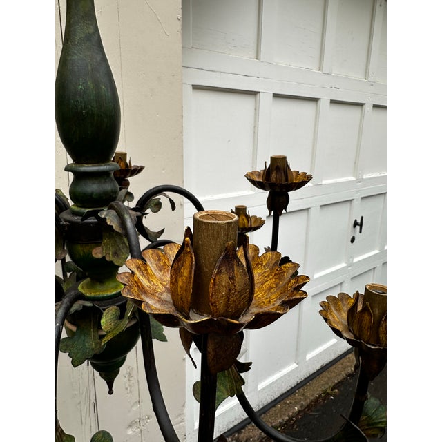 Old Lights On is pleased to offer this vintage ten lightwood and metal chandelier with brass tassles. It is wired and...