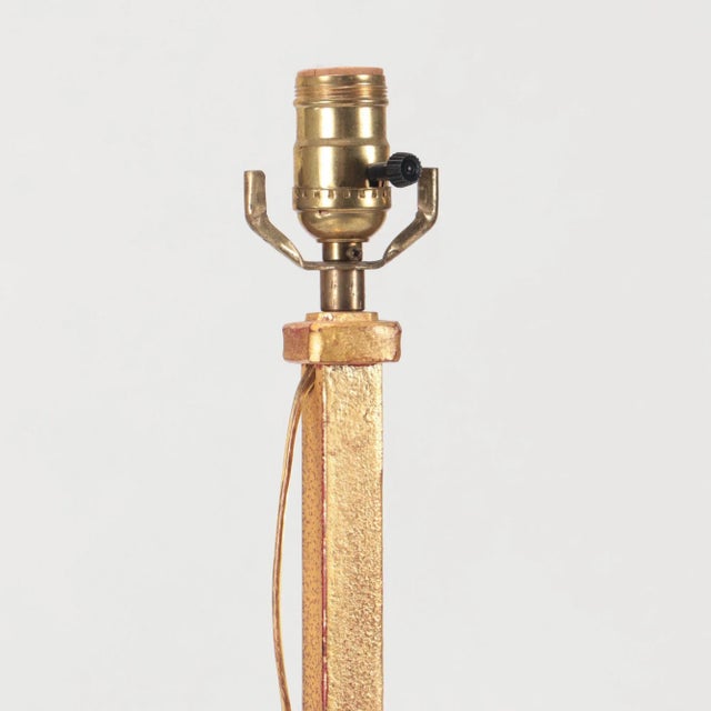 A gilt iron floor lamp in the manner of Raymond Subes C 1940.