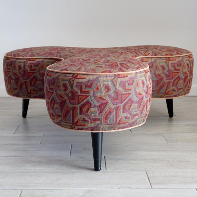 1990s trefoil ottoman designed by Milo Baughman for Thayer Coggin. This ottoman or footstool is covered in a geometric...