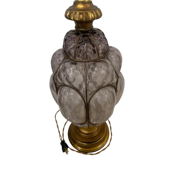 These are 1960s murano violet caged blown bible glass lamps. They are attributed to Seguso.