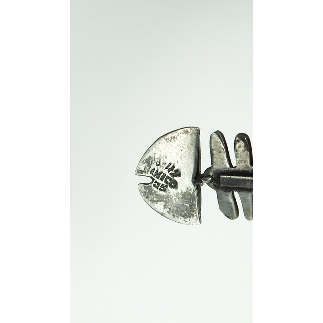 Vintage mid 20th century sterling silver fish shape earrings. Made in Mexico, stamped 925 on back. Heads are hollow...