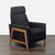 This West Elm lounge chair features a sleek black fabric with subtle specks and a sturdy wooden frame. Designed for...