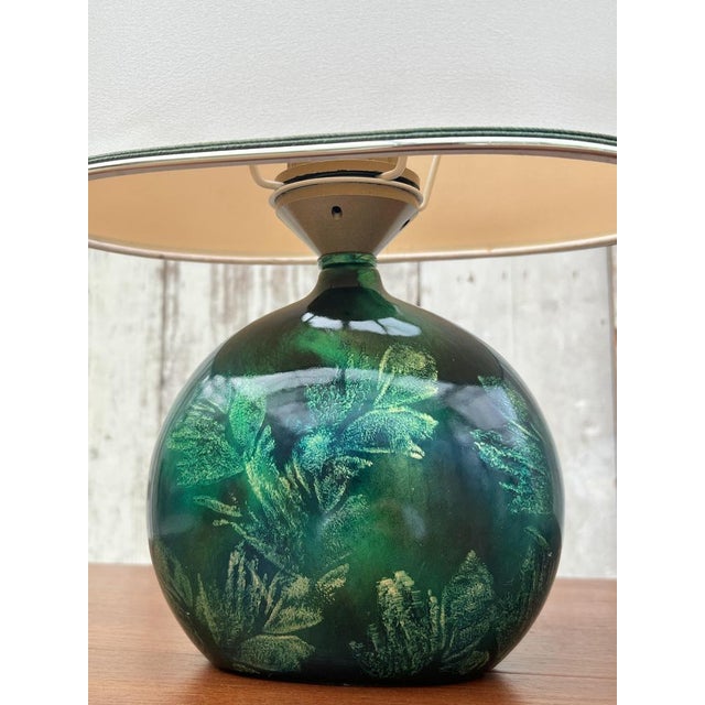 Introducing the ultimate statement piece for your home decor: the Maison le Dauphin vintage green table lamp from the...