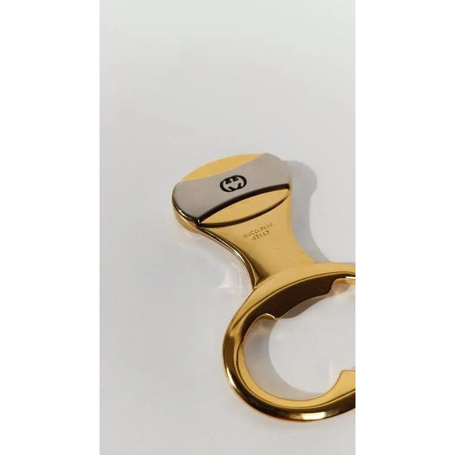 An elegant vintage bottle opener by Gucci. Made in Italy around the 1970s, this bottle opener features a sleek, minimalist...