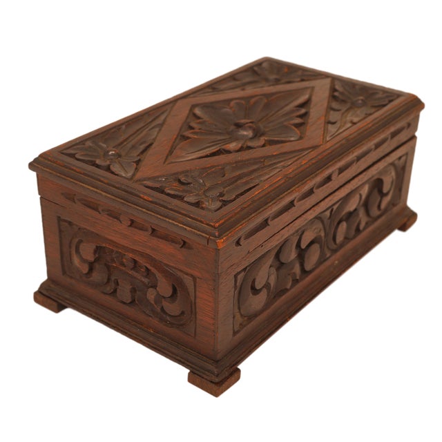Late 19th Century Carved Oak Box with Foliate Decoration, English 1880. Handcrafted from solid oak, this box is...