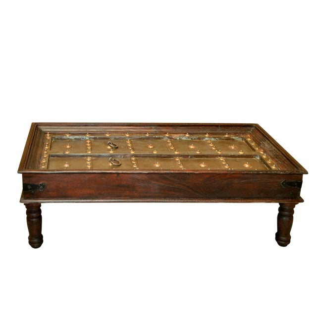 Dimensions: 65″ W x 32″ D x 18″ H Satiate your traditional soul by bringing this antique door coffee table into your home....