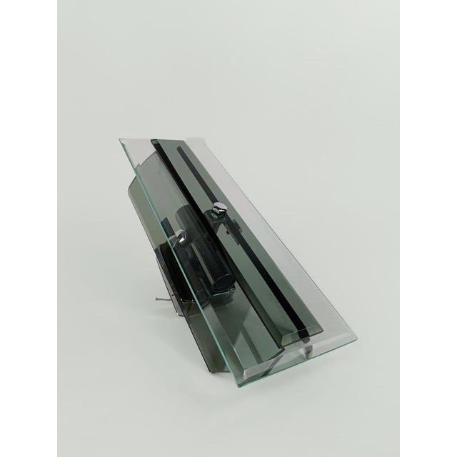 a pair of wall lamps certainly made in Italy between the 60s and 70s, the style is that of the Italian company known in...