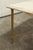 Marble and brass coffee table in the style of Maison Jansen. Metal base with screwed brass legs and a cross with a four-...