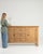 Here is a cabinet, its natural honey oak, paneled door the first thing to catch the eye. It was made in France during...