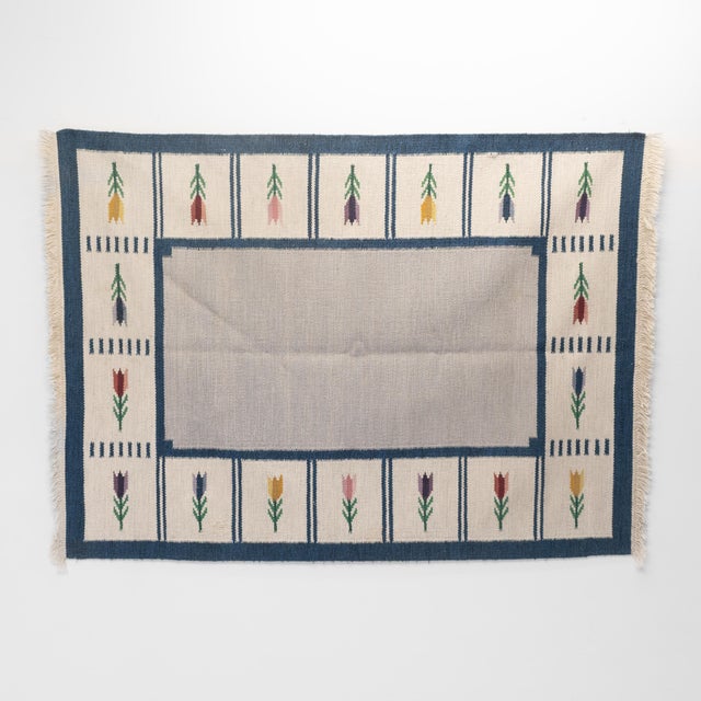 Mid-Century Swedish kilim in a sectional floral pattern. Area's worn as shown in images. Sweden circa 1960. Allrugs...