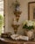 A decorative pair of mid-20th-century Italian wall shelves, hand carved in an open Rococo form with curling scrolls,...