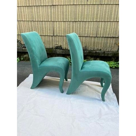 A matching pair of Dialogica Splash Chairs by Sergio and Monique Savarese. Each chair is completely wrapped in teal...