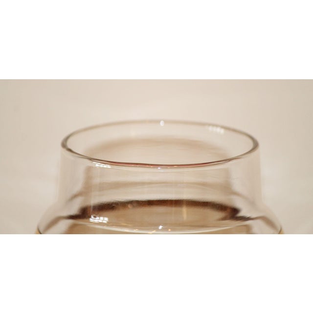 This authentic cocktail shaker from the 1940s is made of a lightweight glass, banded with cranberry flashing and gold...