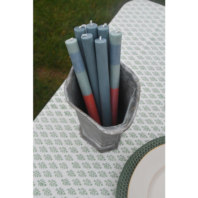 Silver plate pitcher with an angular, paneled body and hand-hammered surface, raised on an octagonal foot. Features a...